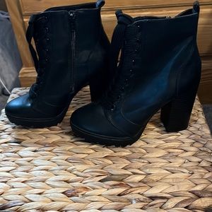 Women’s black tall heel boot with thick sole